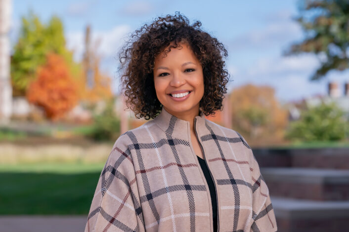 Portriat of Atia Thurman with fall foliage in the background