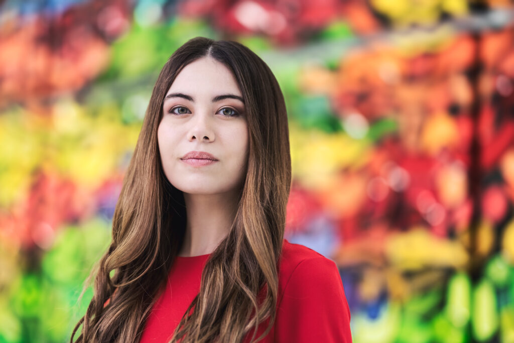 Portrait of a person with fall foliage in the background